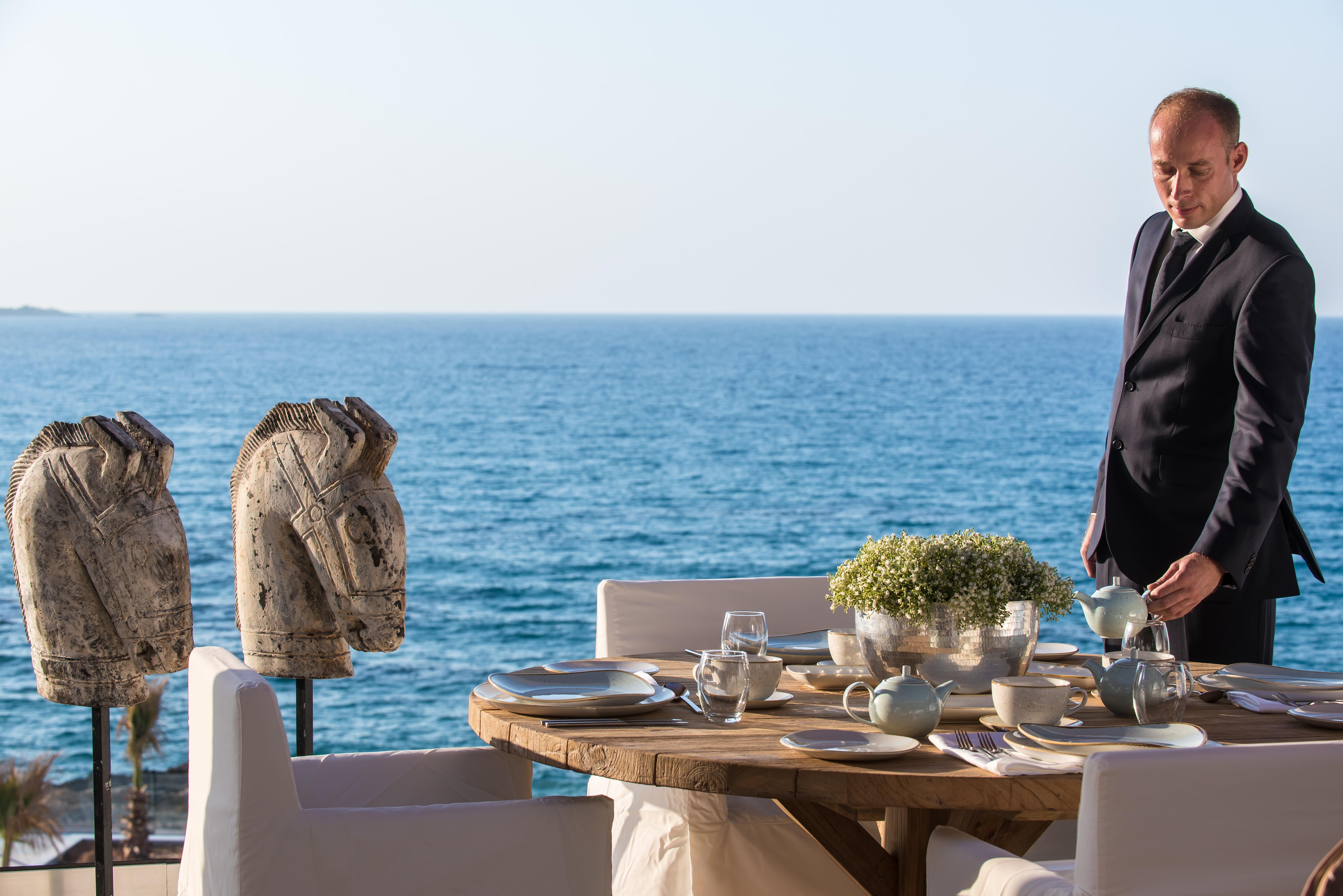 Abaton Island Resort & Spa Hersonissos  Exterior photo A butler at the Four Seasons Hotel, Mykonos, Greece
